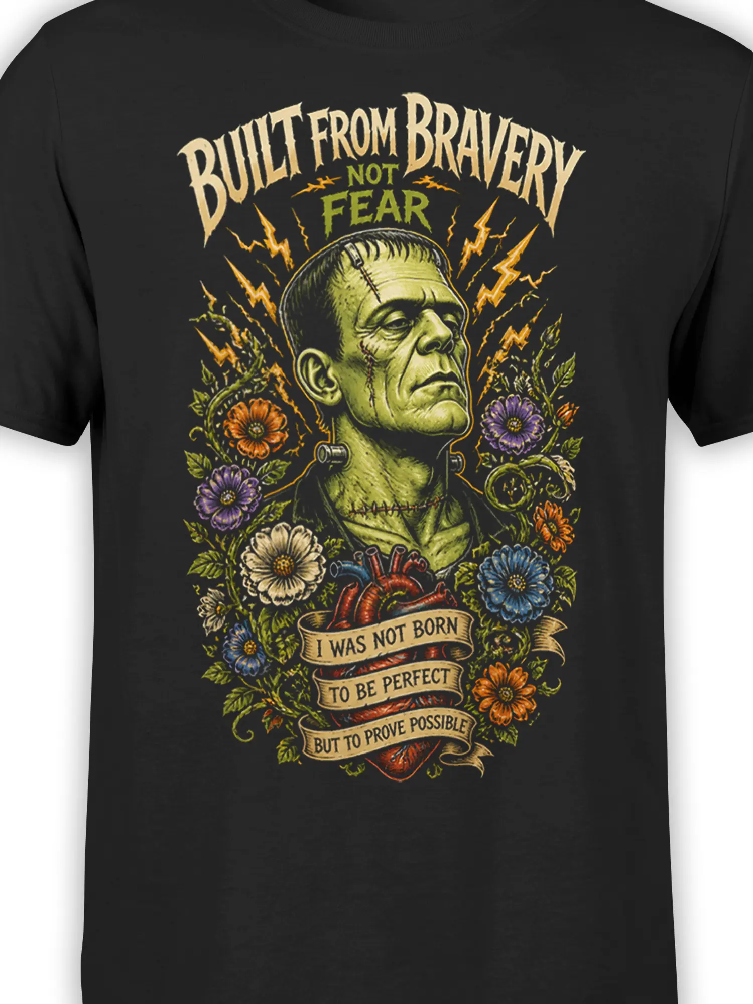 Close-up of stitched green creature, floral details, lightning bolts, and banners on black fabric