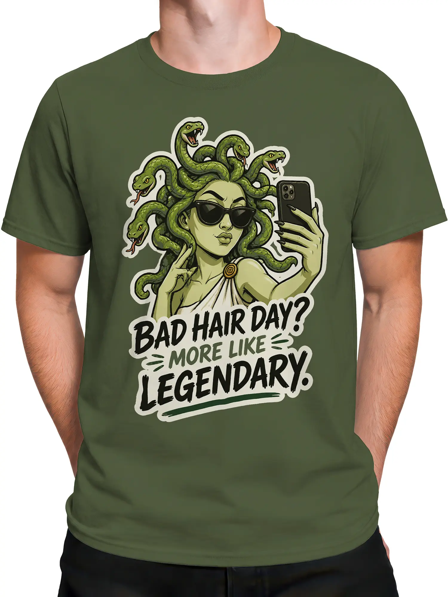 Male torso wearing a green gorgon graphic tee with snakes, sunglasses, smartphone, and bold legendary lettering
