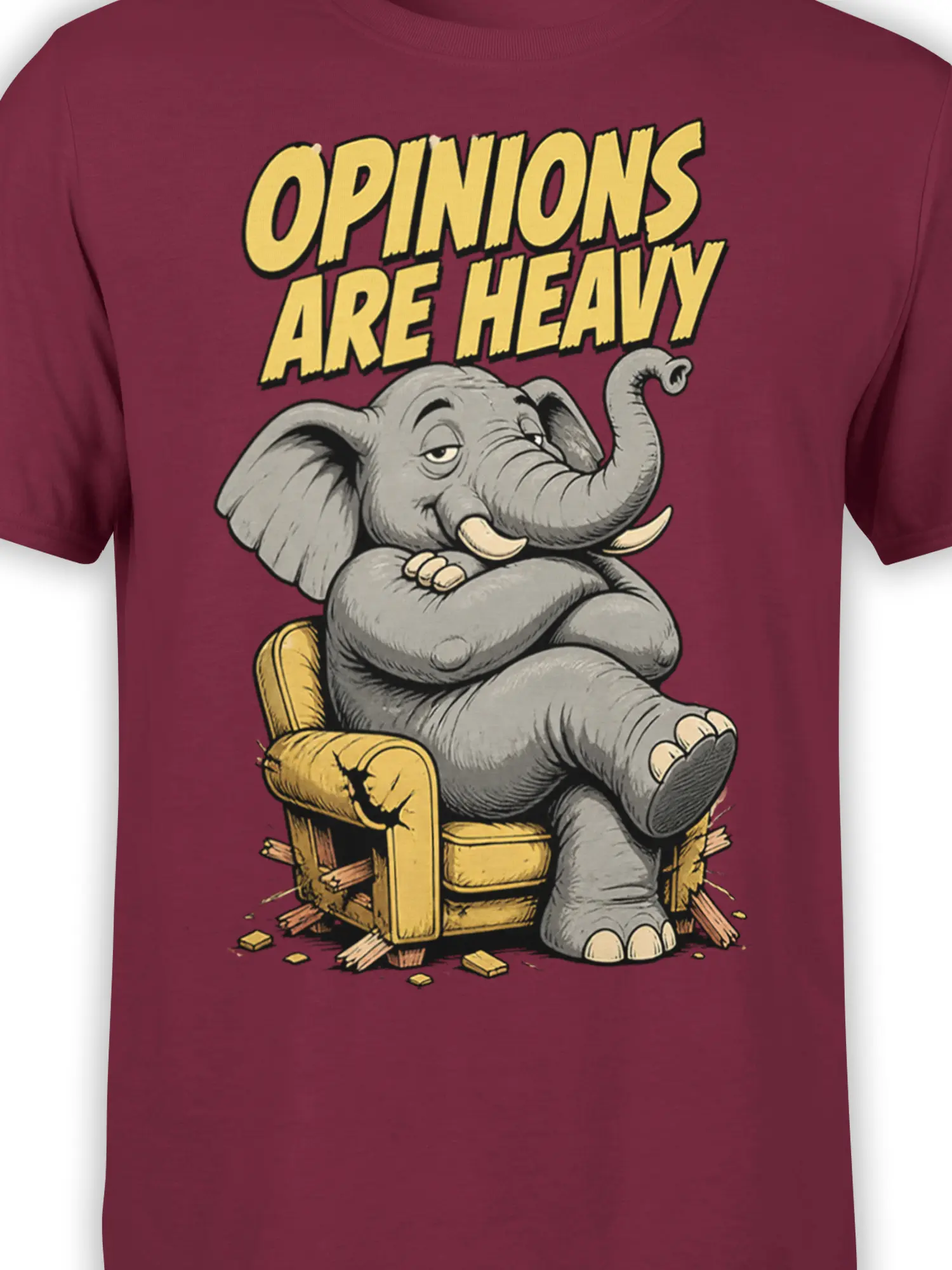 Close-up of the gray elephant, broken golden chair, and bold “Opinions Are Heavy” graphic on a burgundy shirt