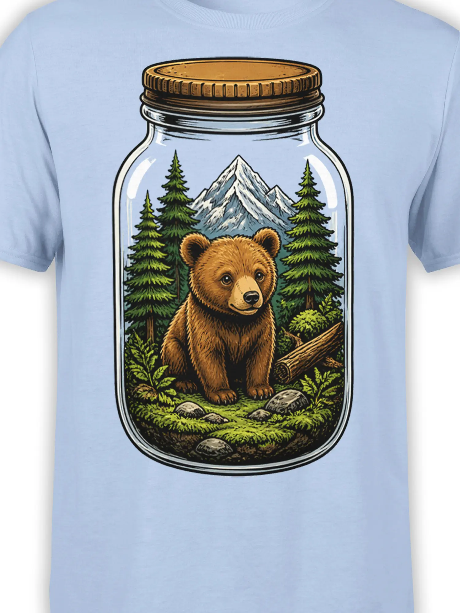 Close-up of bear in jar artwork with pine forest and mountain scenery on a light blue T-shirt