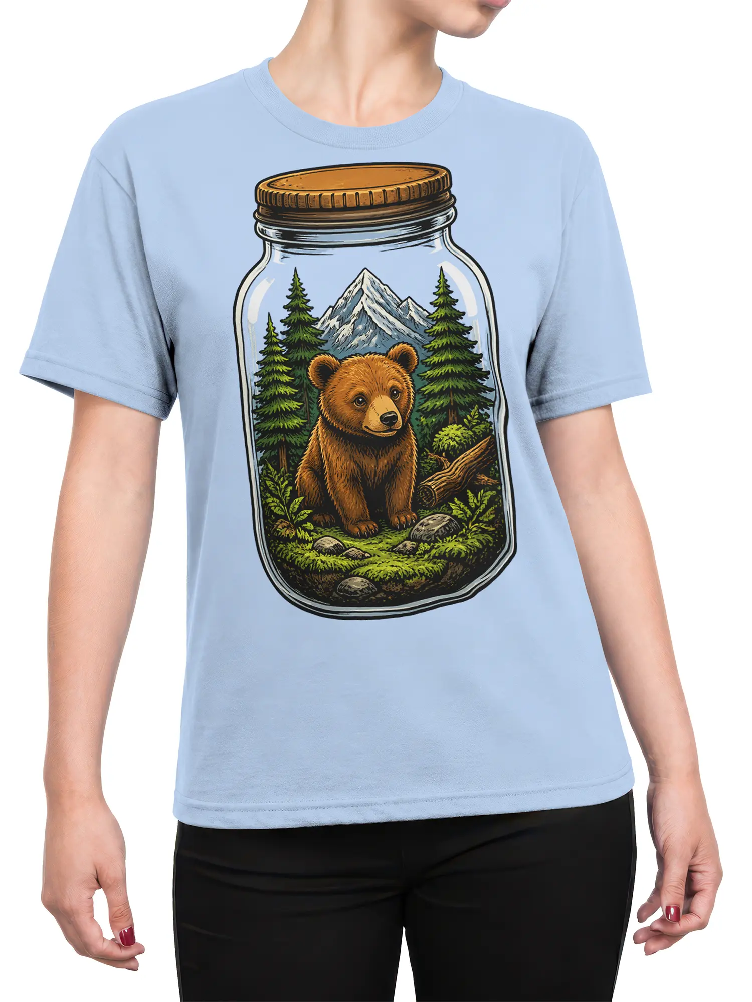 Female torso wearing a light blue bear graphic tee with a forest jar and mountain design