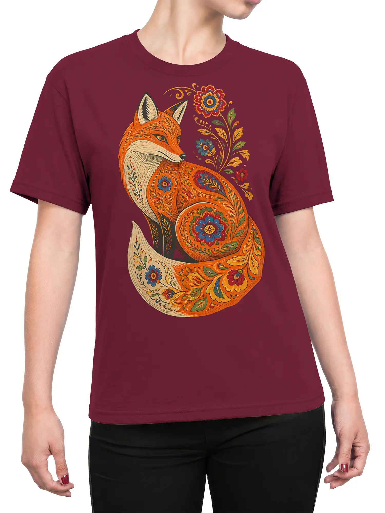 Female torso wearing a burgundy T-shirt with a colorful floral fox and folk-art botanical design