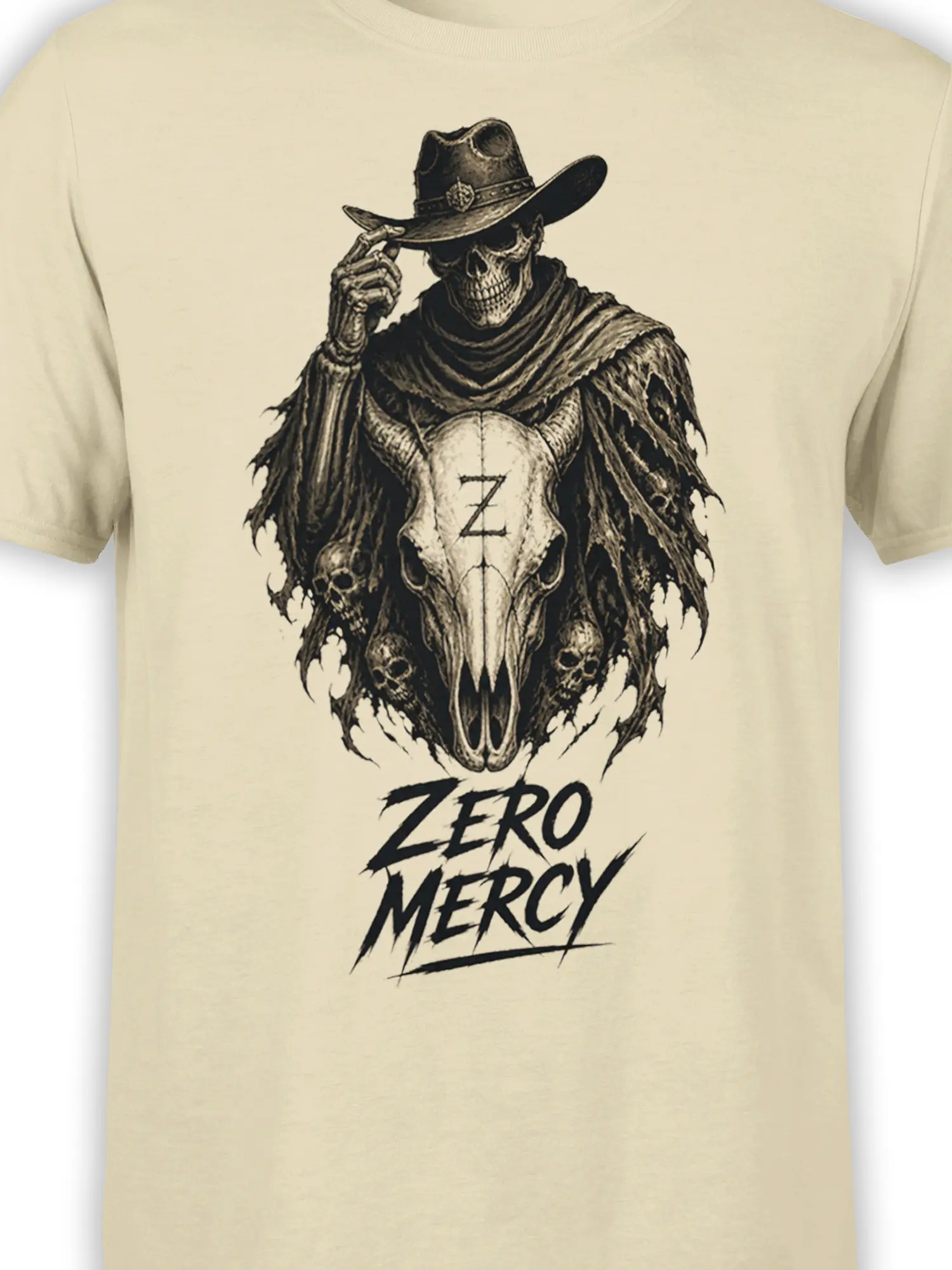 Close-up of the horned cowboy skull graphic and Zero Mercy lettering on a beige T-shirt