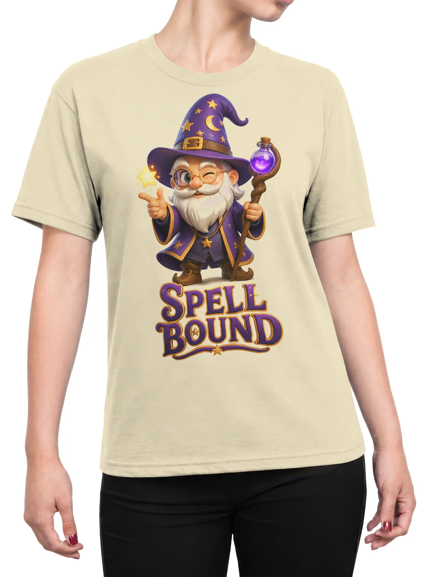 Female torso wearing a beige wizard T-shirt with purple spell caster artwork, golden stars, potion staff, and SPELL BOUND design