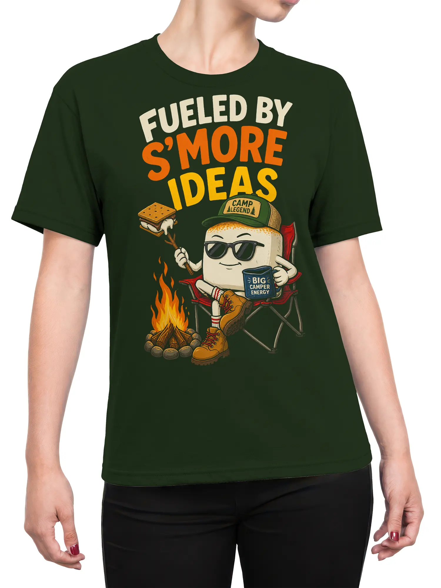 Female torso wearing a green s'more camping T-shirt with campfire artwork and Fueled by S'more Ideas text