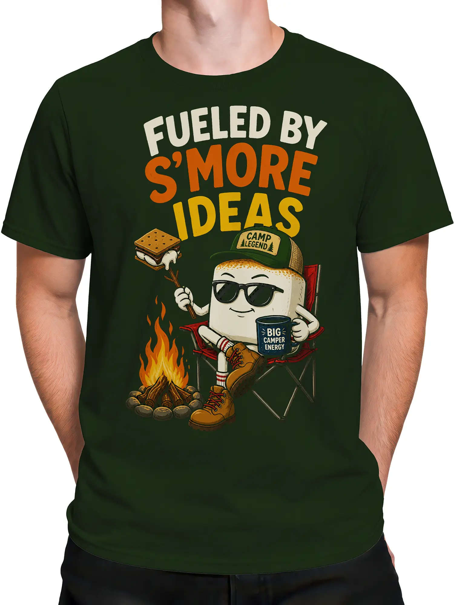 Male torso wearing a green camping T-shirt with a s'more character, campfire, and bold graphic text