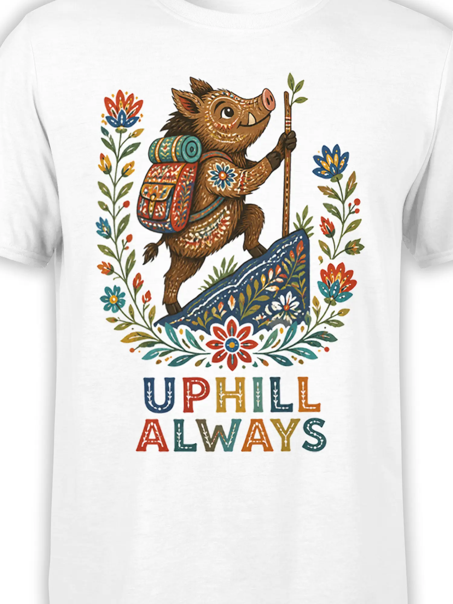 Close-up of the colorful boar hiker, floral details, backpack, and UPHILL ALWAYS lettering on a white shirt