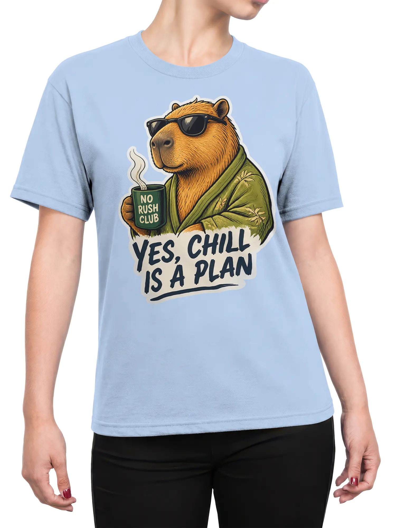 Female torso wearing a light blue capybara T-shirt with sunglasses, mug, and “YES, CHILL IS A PLAN” artwork