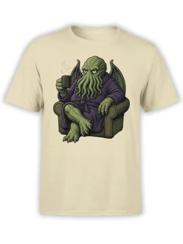 Beige T-shirt with a winged green tentacle monster in a purple robe holding a steaming mug