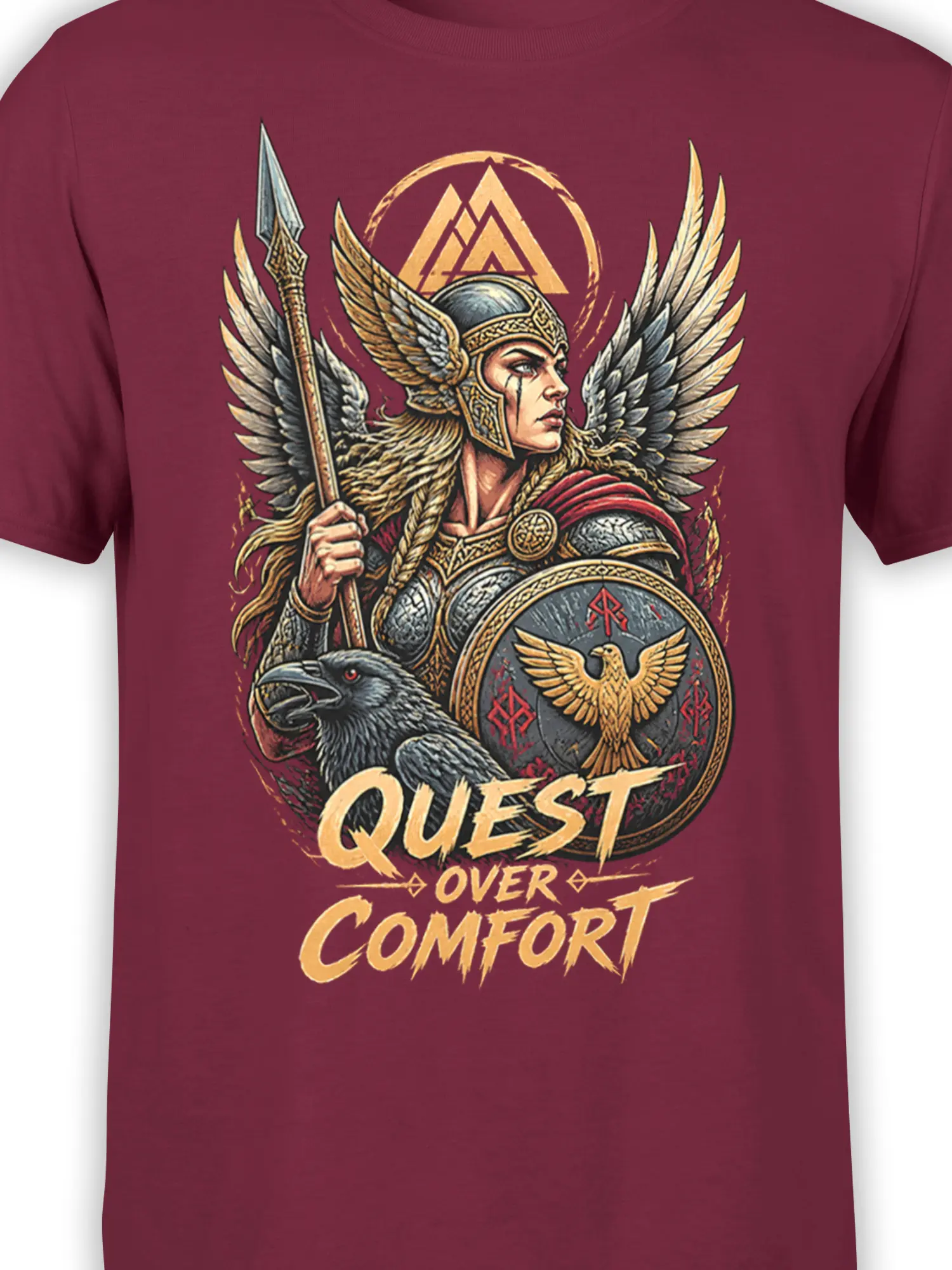 Close-up of winged warrior fantasy artwork, raven, shield, and gold “Quest Over Comfort” text on burgundy fabric