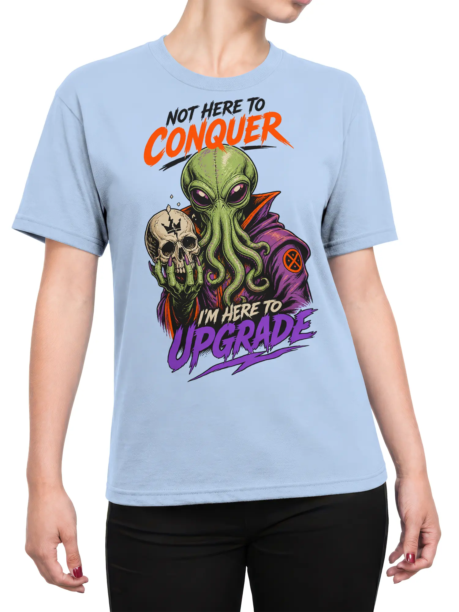 Female torso wearing a light blue alien graphic tee with a skull and bold purple upgrade lettering