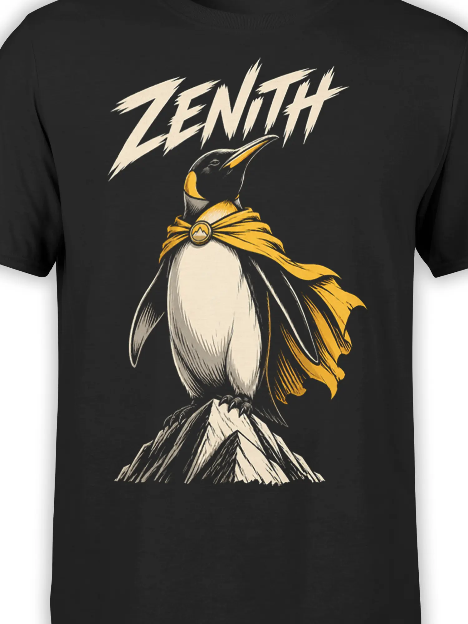 Close-up of the caped penguin and mountain peak artwork on a black graphic T-shirt