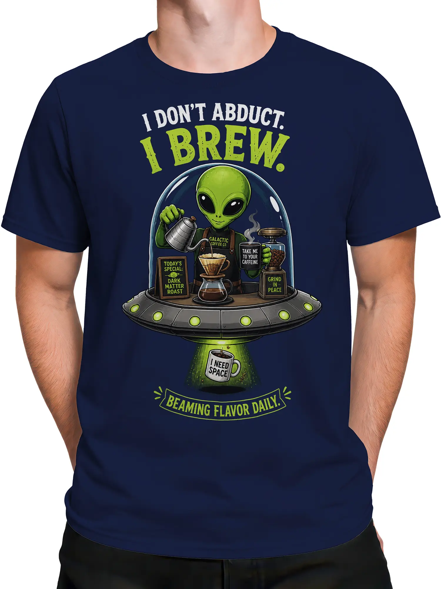 Male torso wearing a navy alien coffee T-shirt with a colorful flying saucer barista design