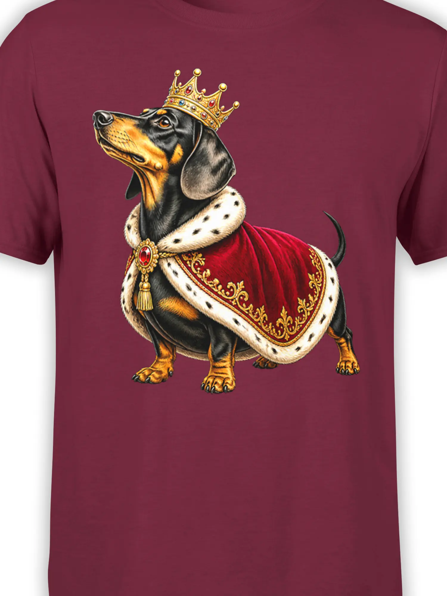 Close-up of crowned black-and-tan dachshund design on a burgundy graphic T-shirt