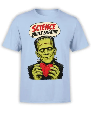 Light blue T-shirt with a green stitched monster holding a red heart and a Science Built Empathy message
