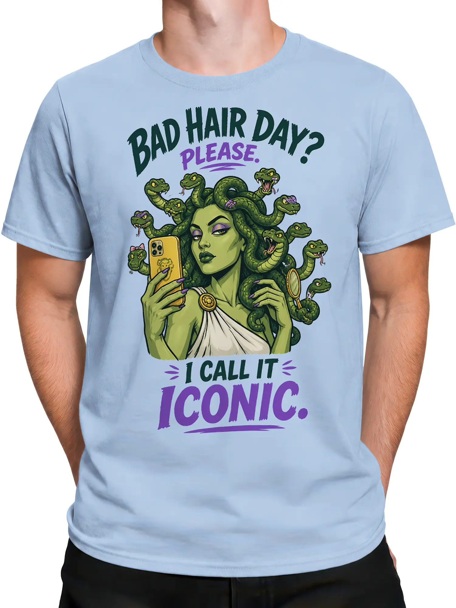 Male torso wearing a light blue Medusa T-shirt with green snakes, purple accents, and bad hair day artwork