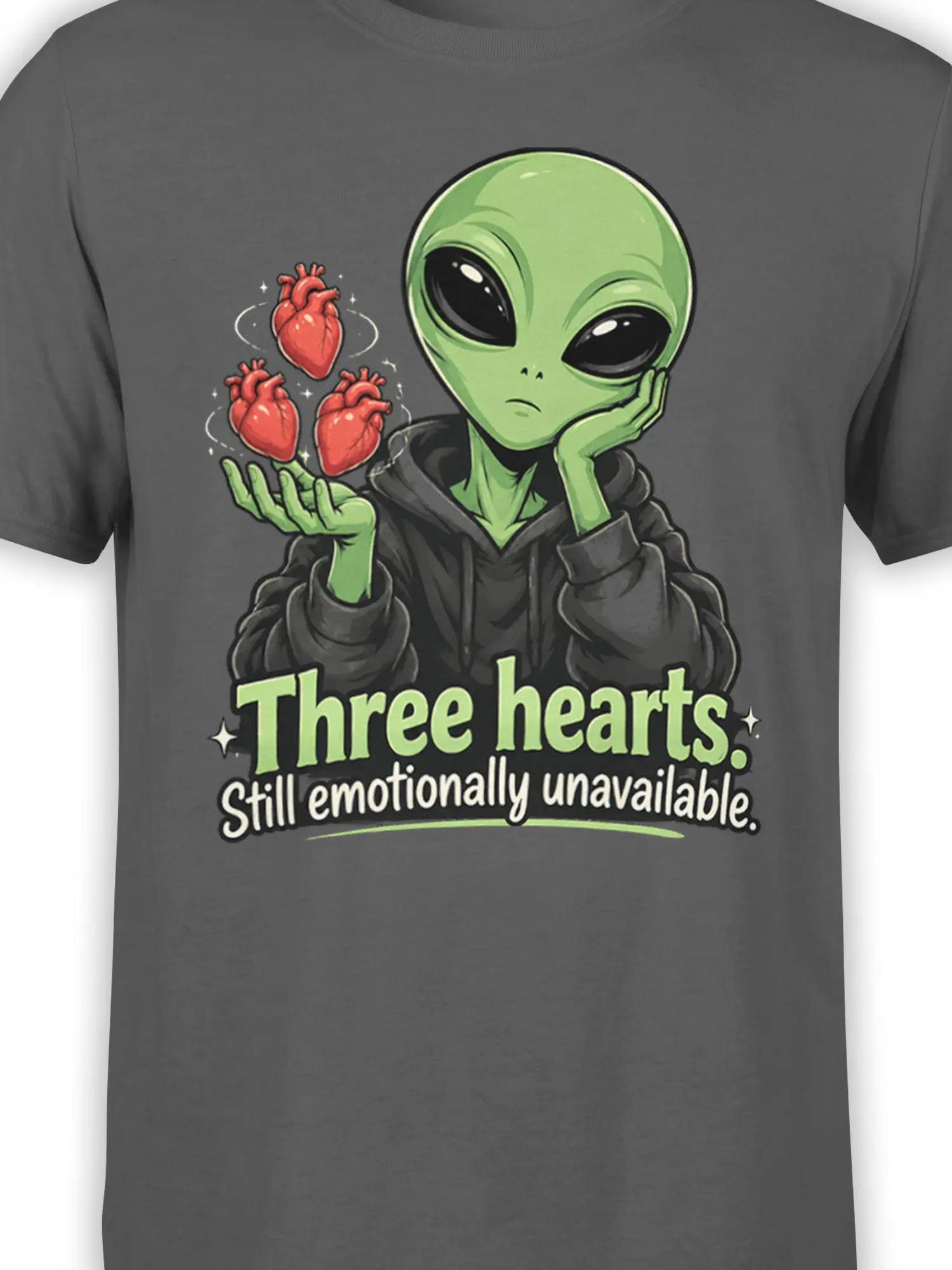 Close-up of the green alien, red hearts, and emotionally unavailable lettering on the gray T-shirt design