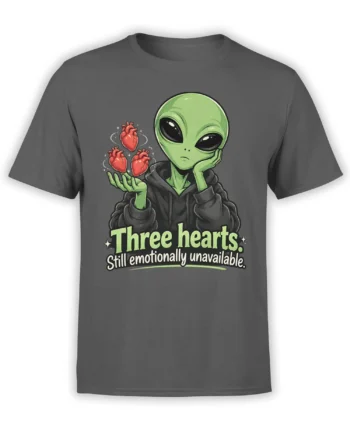 Gray T-shirt featuring a green alien in a hoodie balancing three red hearts with an emotionally unavailable slogan
