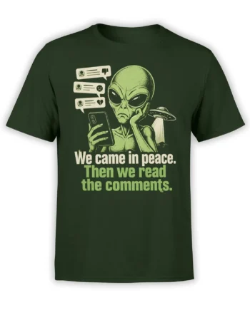 Green alien graphic tee showing an extraterrestrial reading comments beside a flying saucer