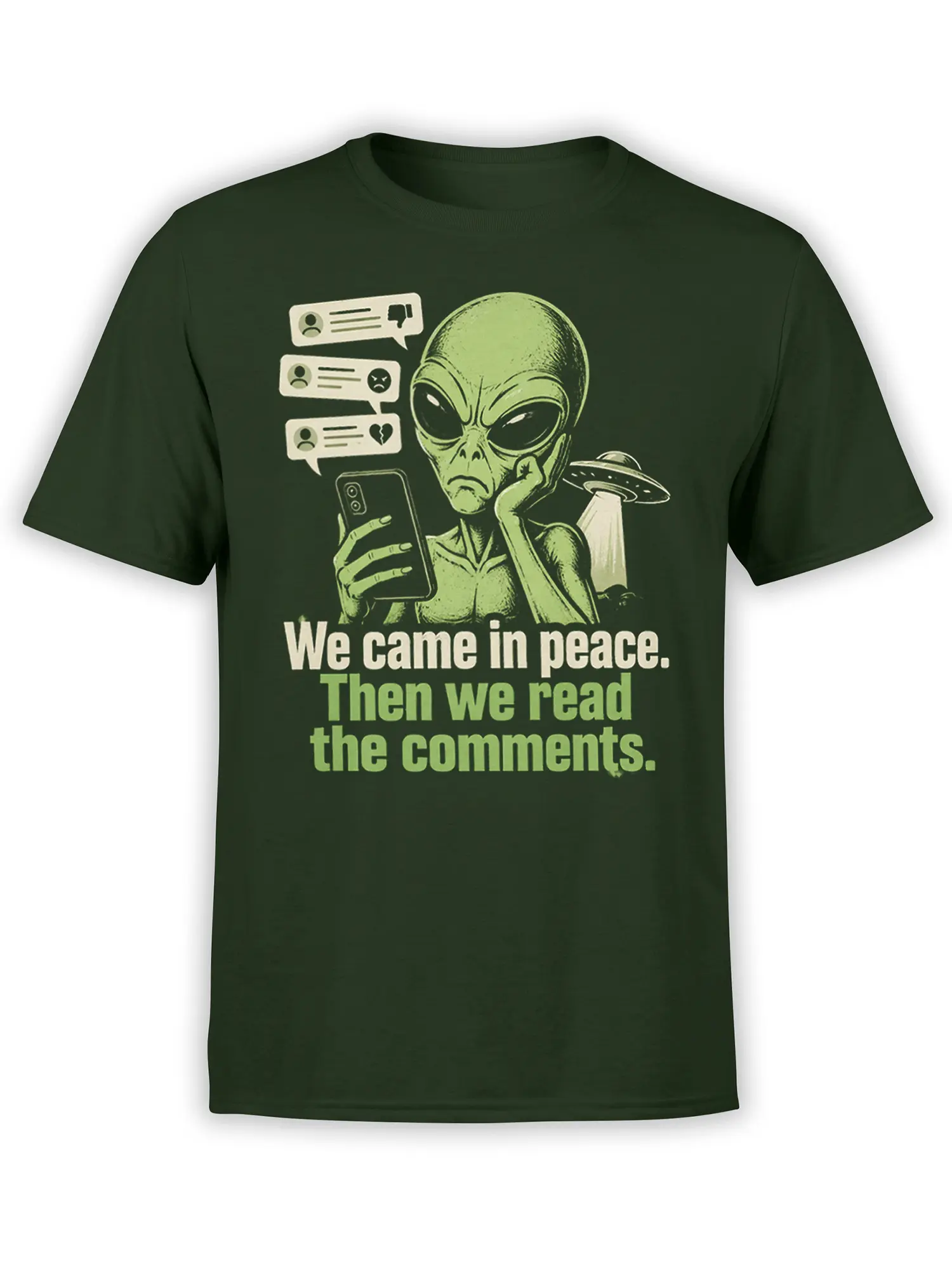 Green alien graphic tee showing an extraterrestrial reading comments beside a flying saucer
