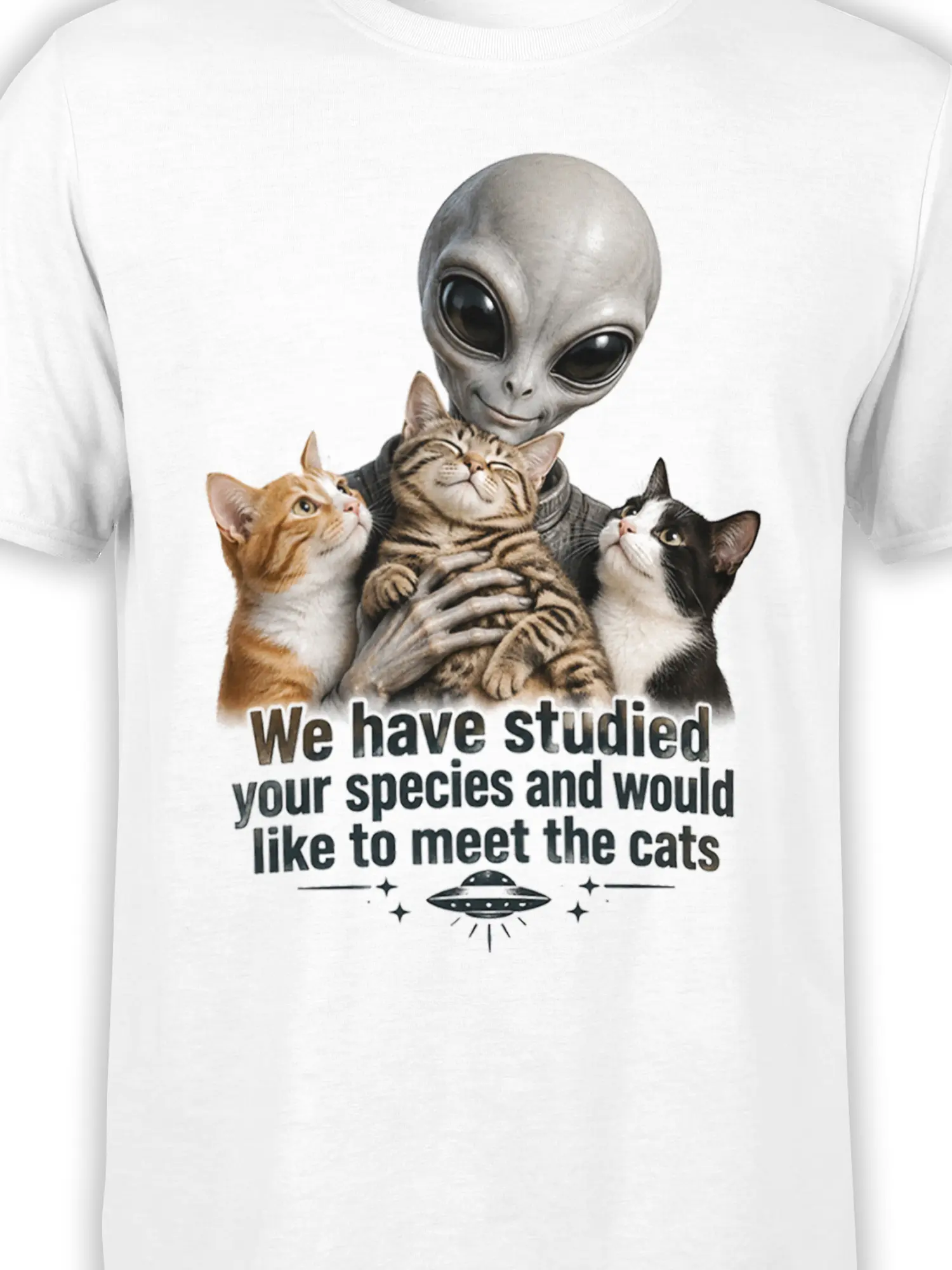 Close-up of alien holding orange, tabby, and black-and-white cats on white graphic tee