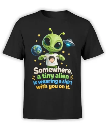 Black T-shirt with a cute green alien, Earth, UFO, stars, and colorful “tiny alien” slogan artwork