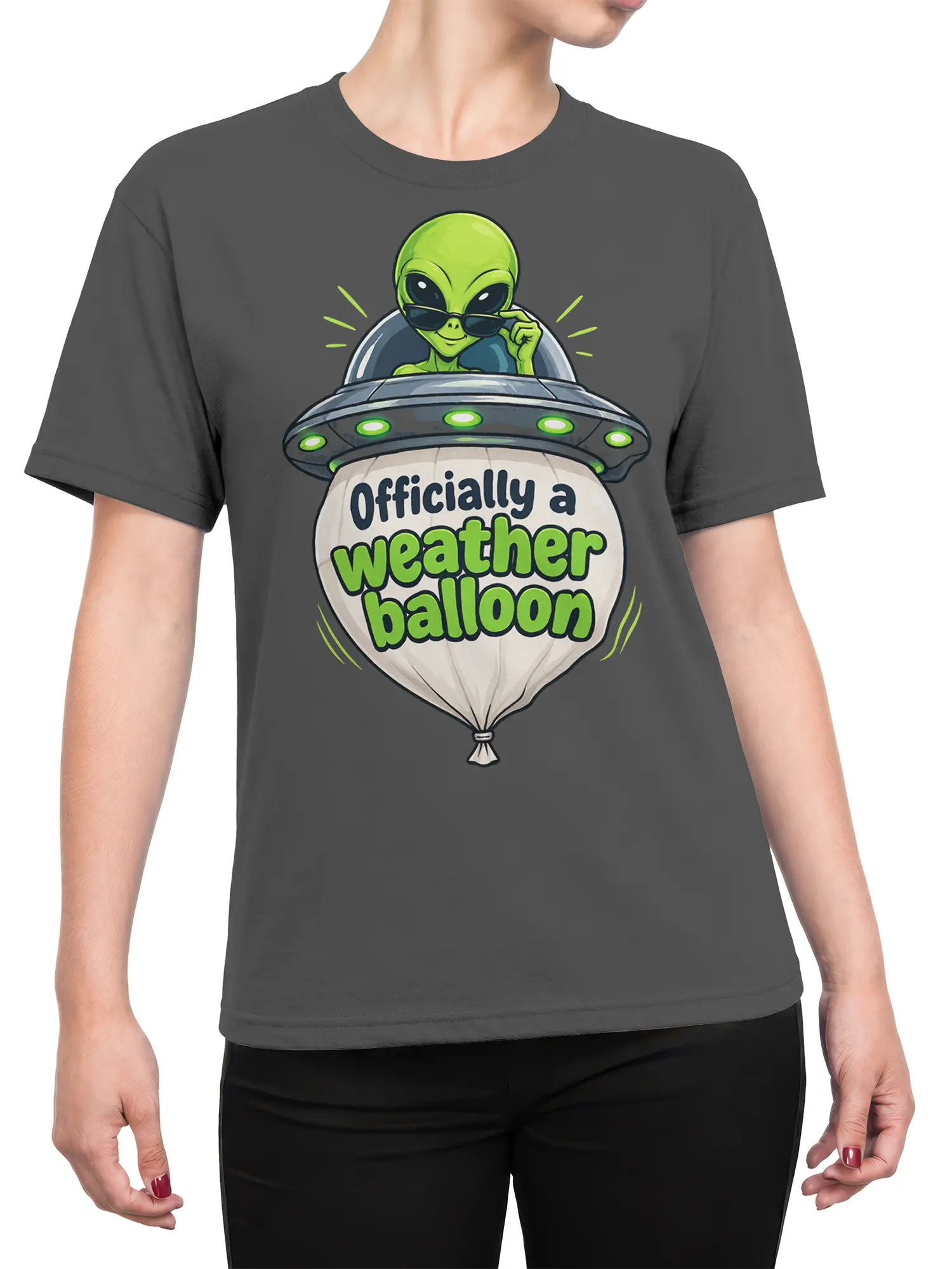 Female torso wearing a gray T-shirt with a green alien UFO and weather balloon graphic