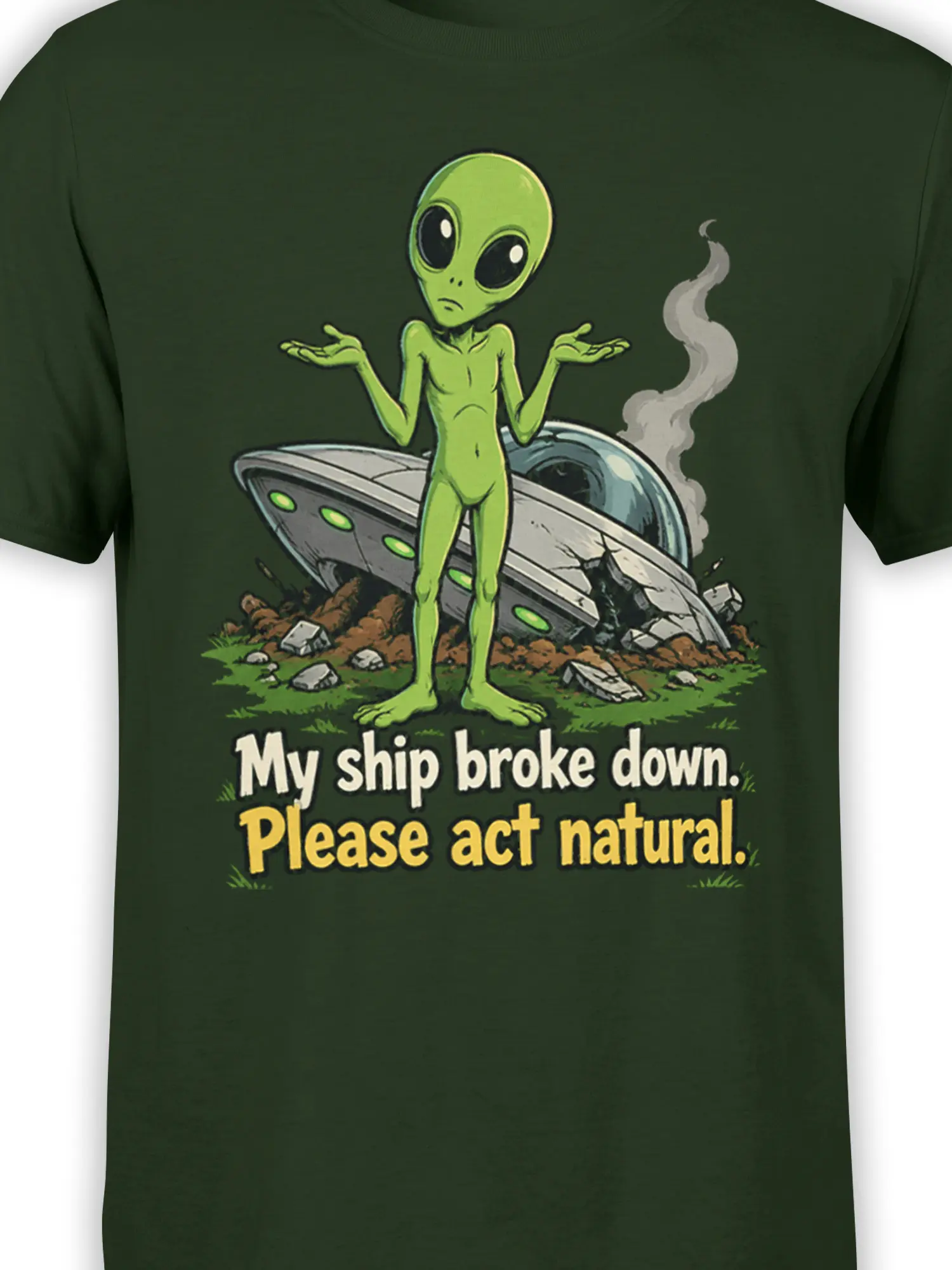 Close-up of green alien and crashed UFO artwork on a dark green graphic T-shirt