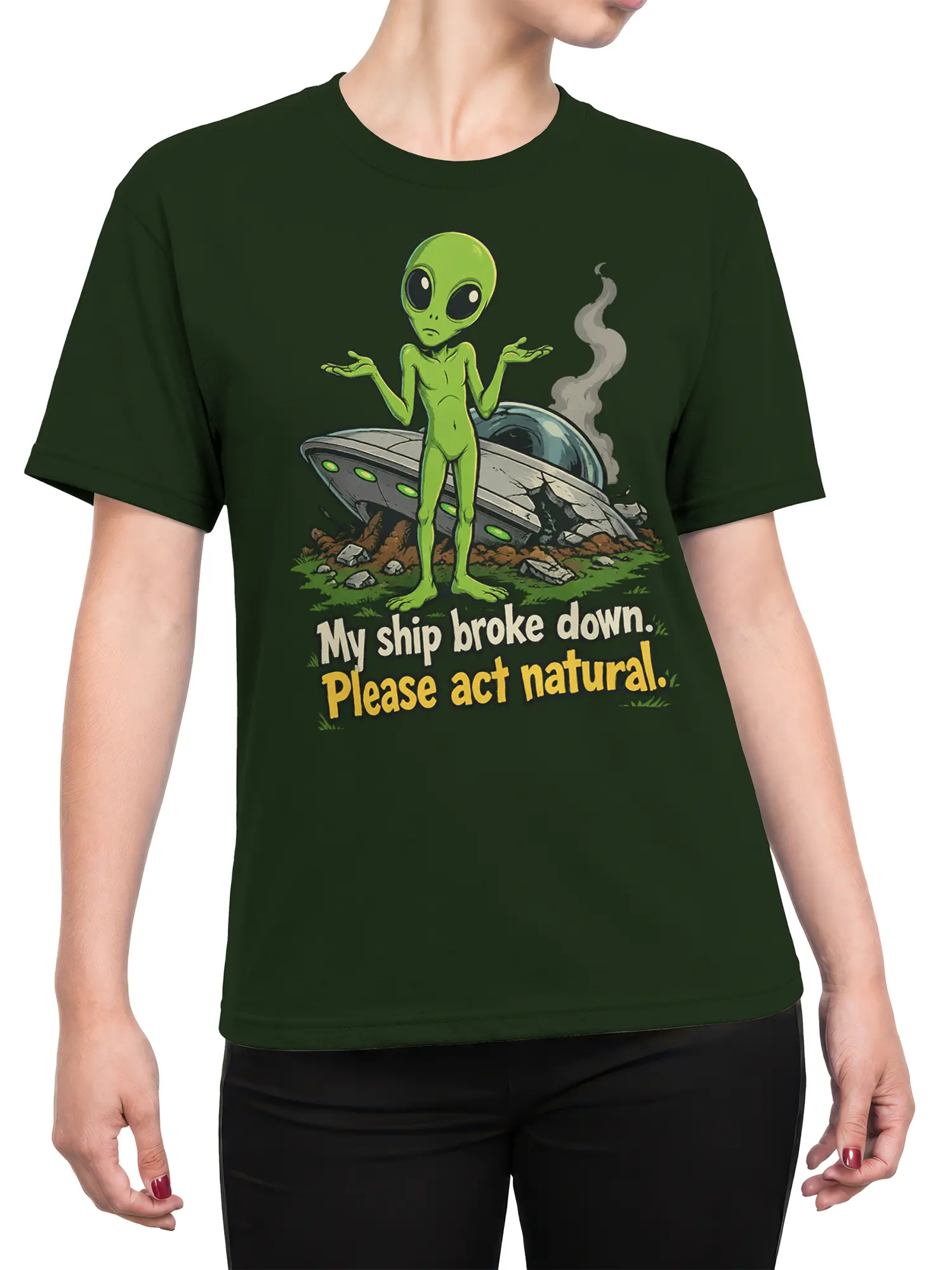 Female torso wearing a dark green alien T-shirt with crashed UFO artwork and humorous lettering
