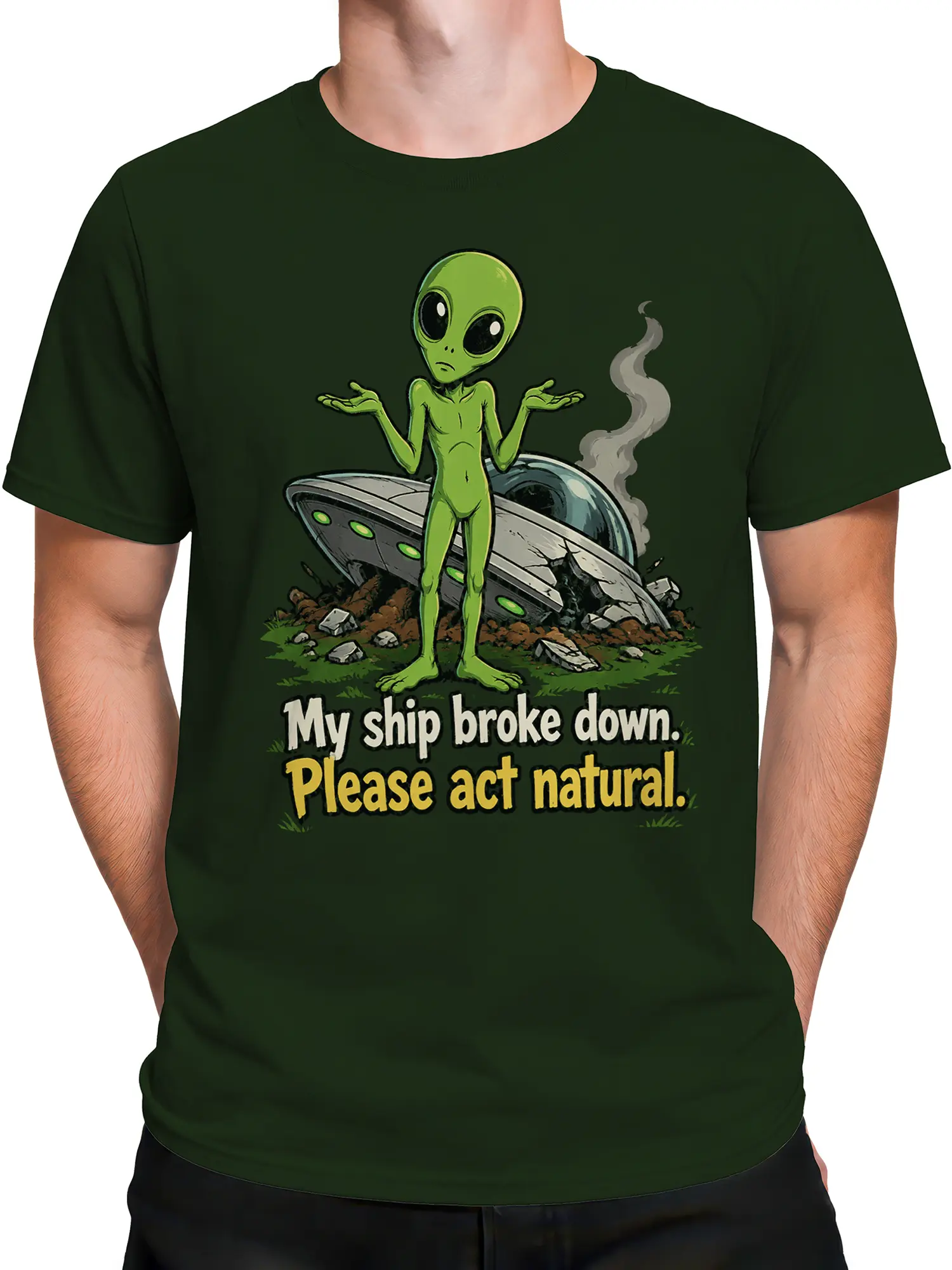 Male torso wearing a dark green alien T-shirt with crashed flying saucer design