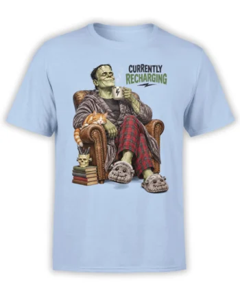 Light blue T-shirt with a stitched green monster recharging in an armchair beside a sleeping orange cat
