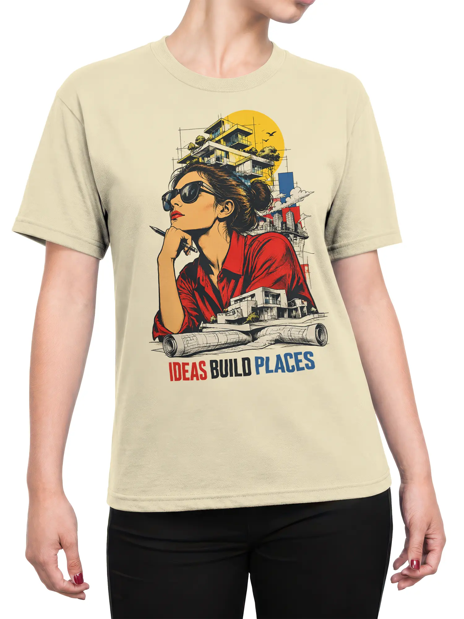 Female torso wearing beige architect T-shirt with woman, blueprints, buildings, and creative design message