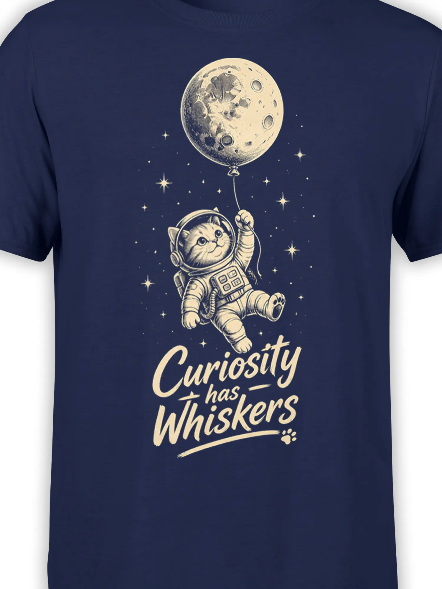 Close-up of astronaut cat, stars, moon-like balloon, and lettering on a navy graphic tee