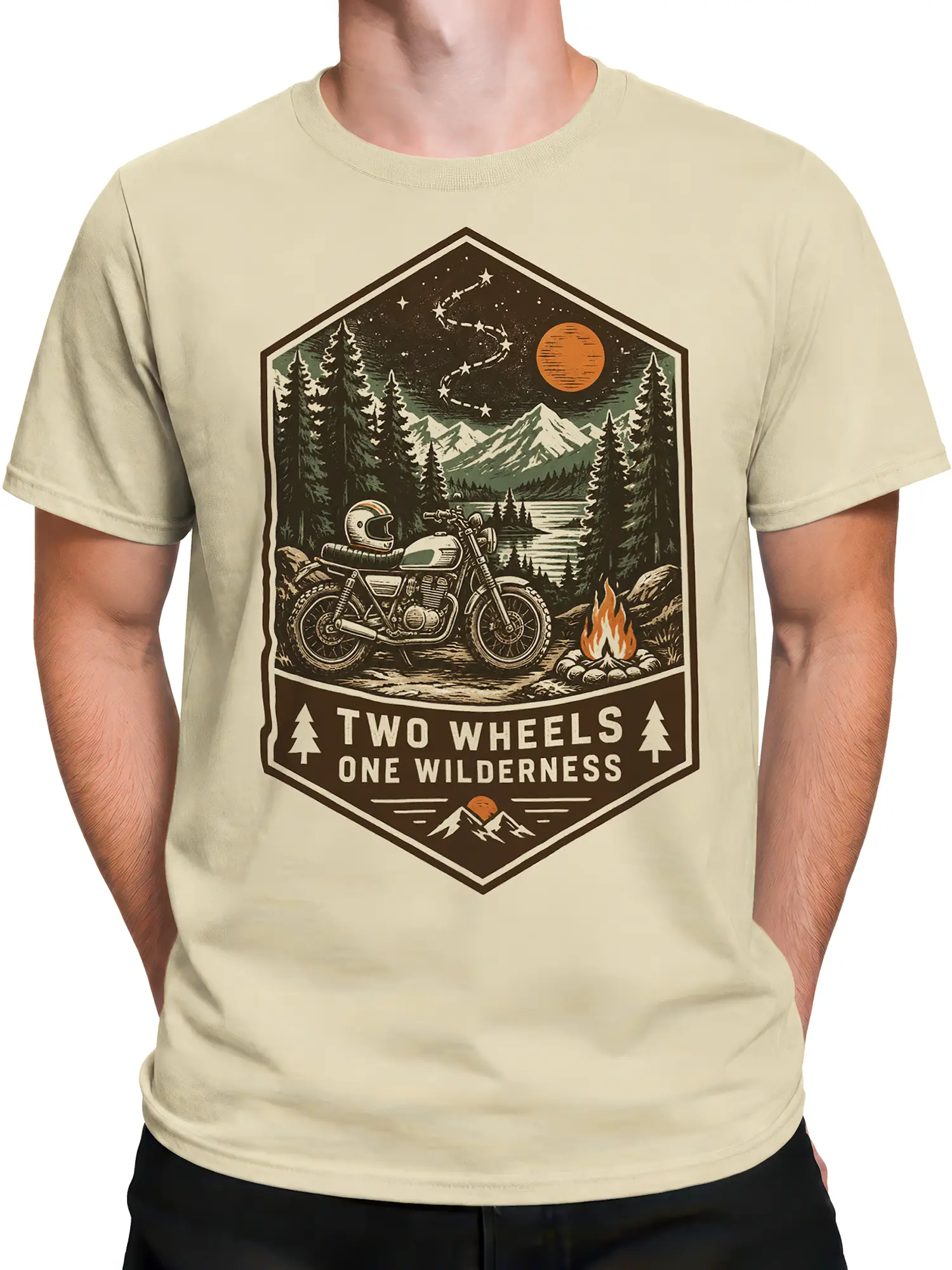 Male torso wearing a beige motorcycle T-shirt with a vintage wilderness, campfire, mountain, and lake graphic