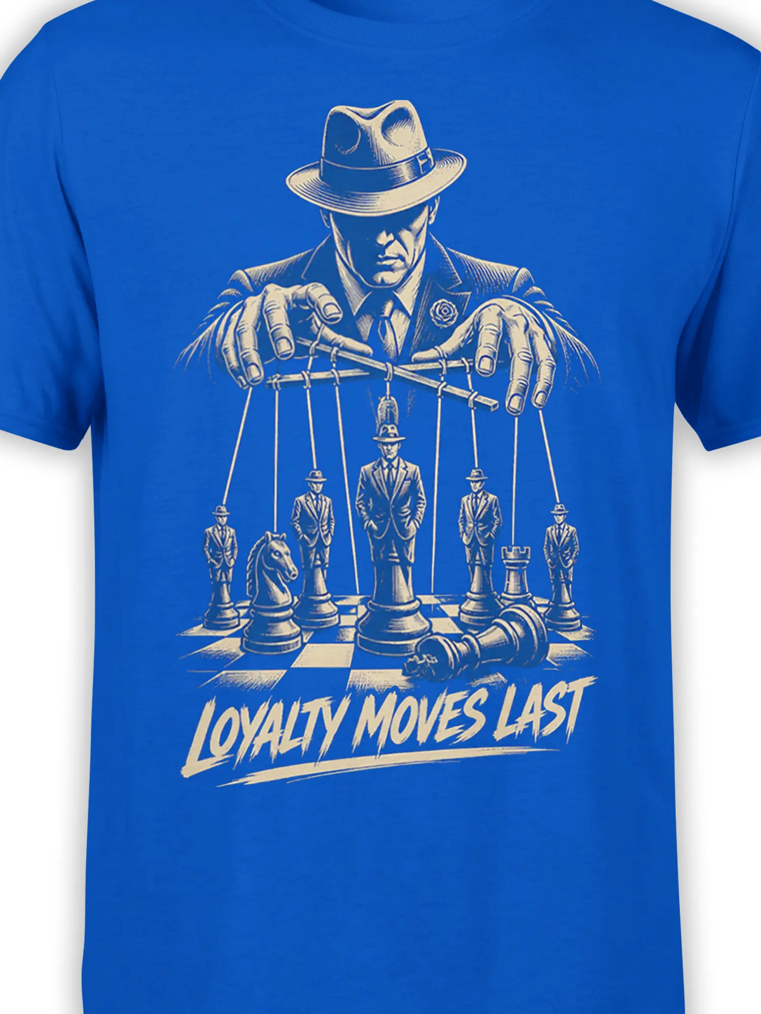 Close-up of a vintage chess puppetmaster design with cream line art and LOYALTY MOVES LAST text on blue fabric