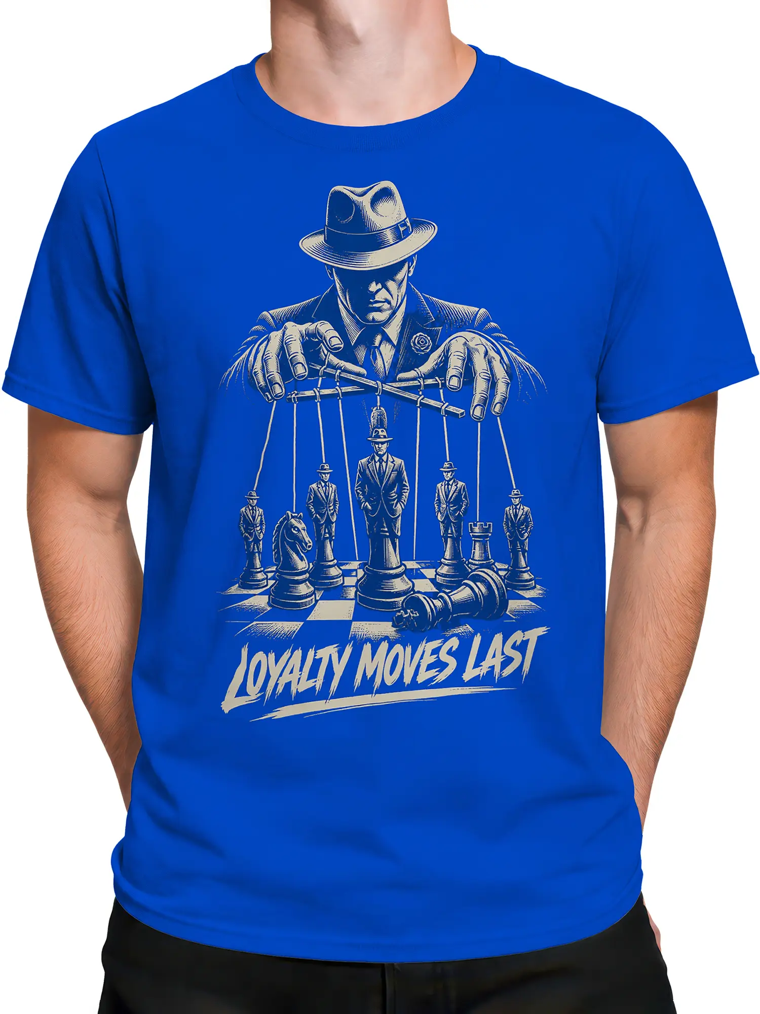 Male torso wearing a blue T-shirt with a vintage chess puppetmaster design, cream line art, and LOYALTY MOVES LAST text