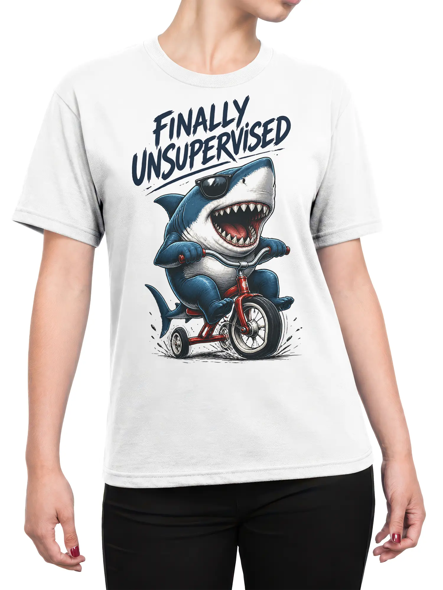 Female torso wearing a white shark graphic tee with sunglasses, a red tricycle, and “FINALLY UNSUPERVISED” lettering