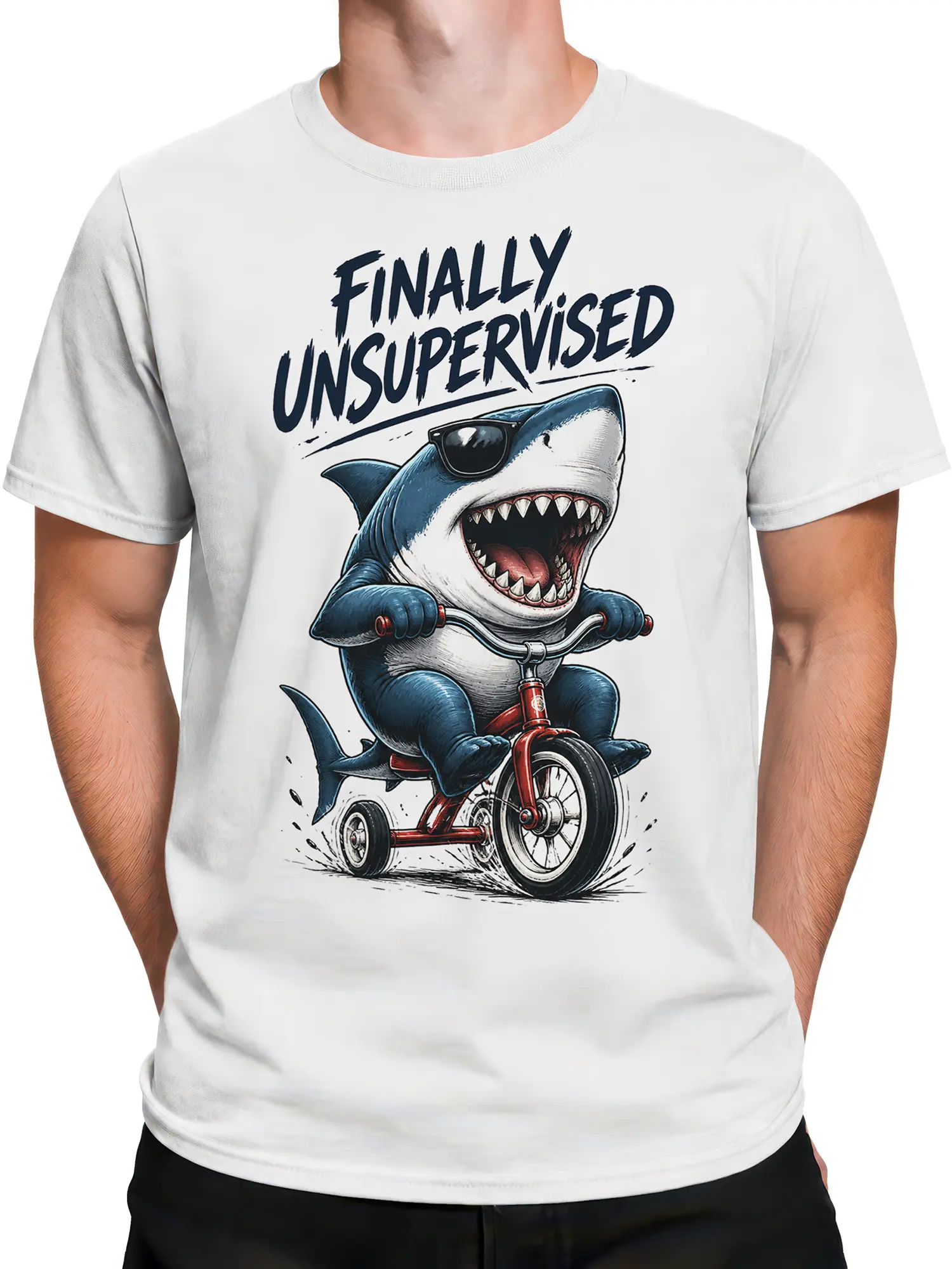 Male torso wearing a white shark graphic tee with a red tricycle and “FINALLY UNSUPERVISED” design