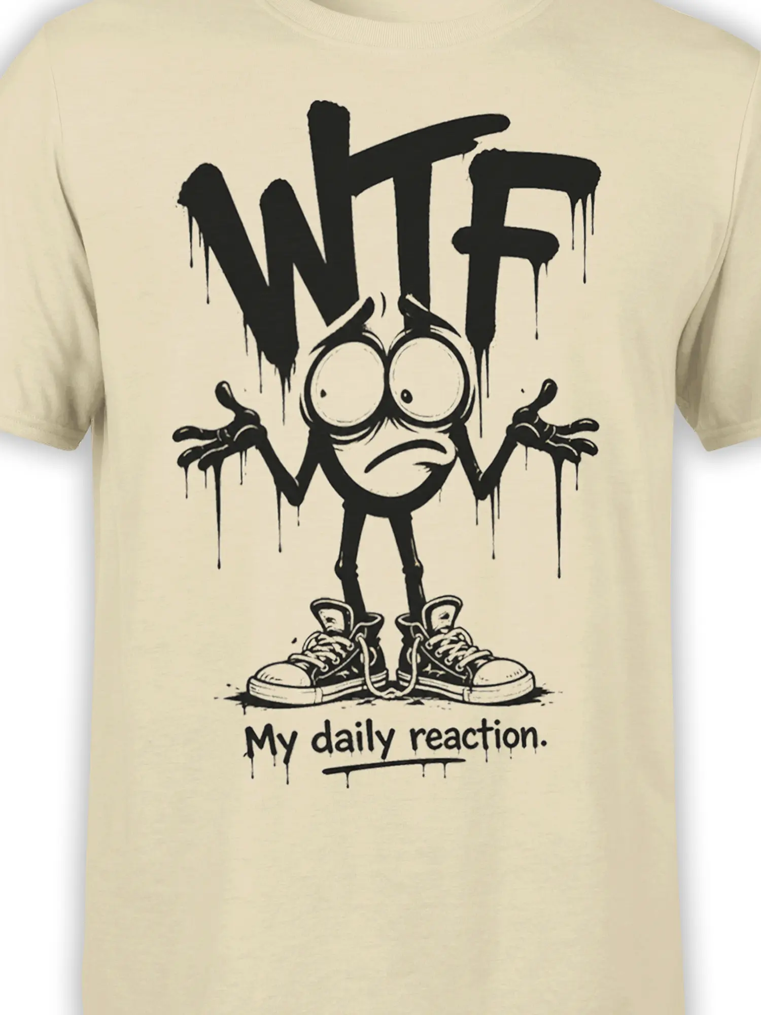 Close-up of distressed black WTF lettering and wide-eyed cartoon reaction character on a beige shirt