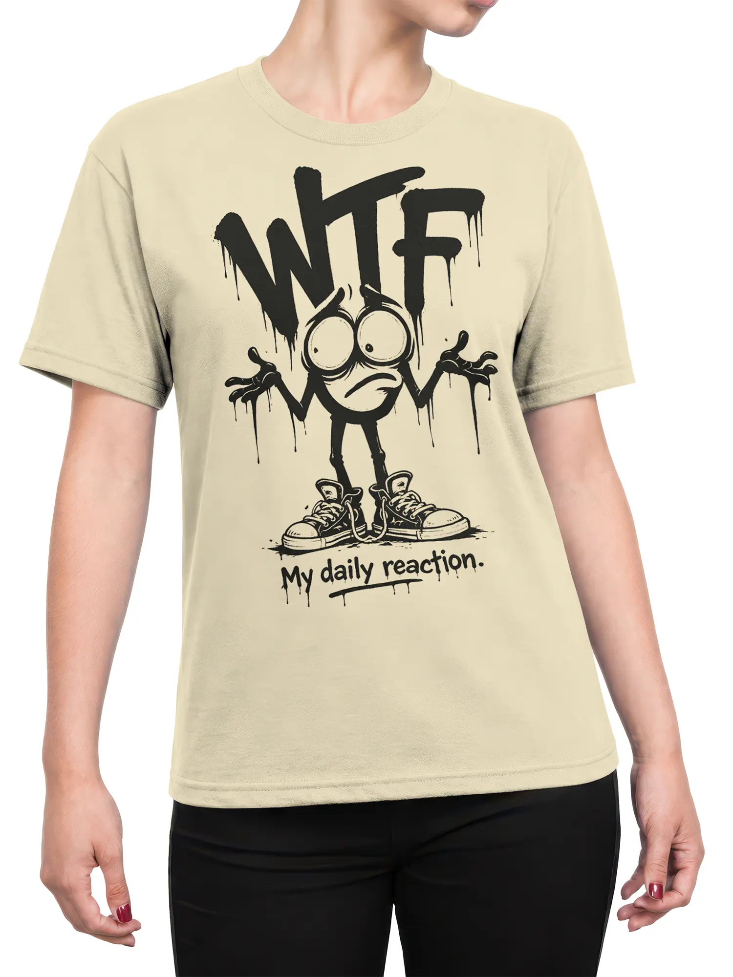 Female torso wearing a beige WTF reaction T-shirt with distressed cartoon artwork and dripping black lettering