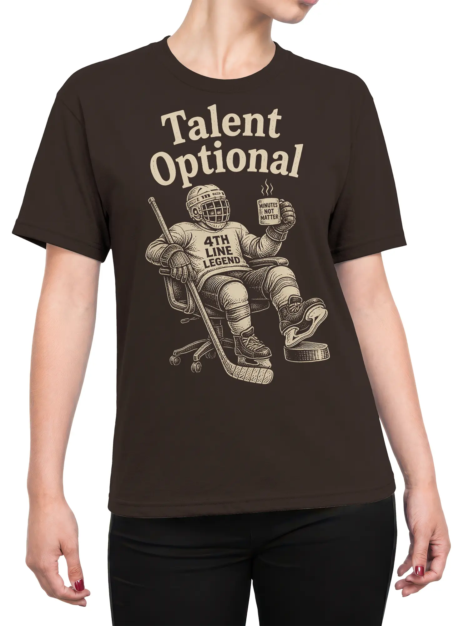 Female torso wearing a brown hockey T-shirt with a relaxed goalie, hockey stick, puck, and Talent Optional graphic