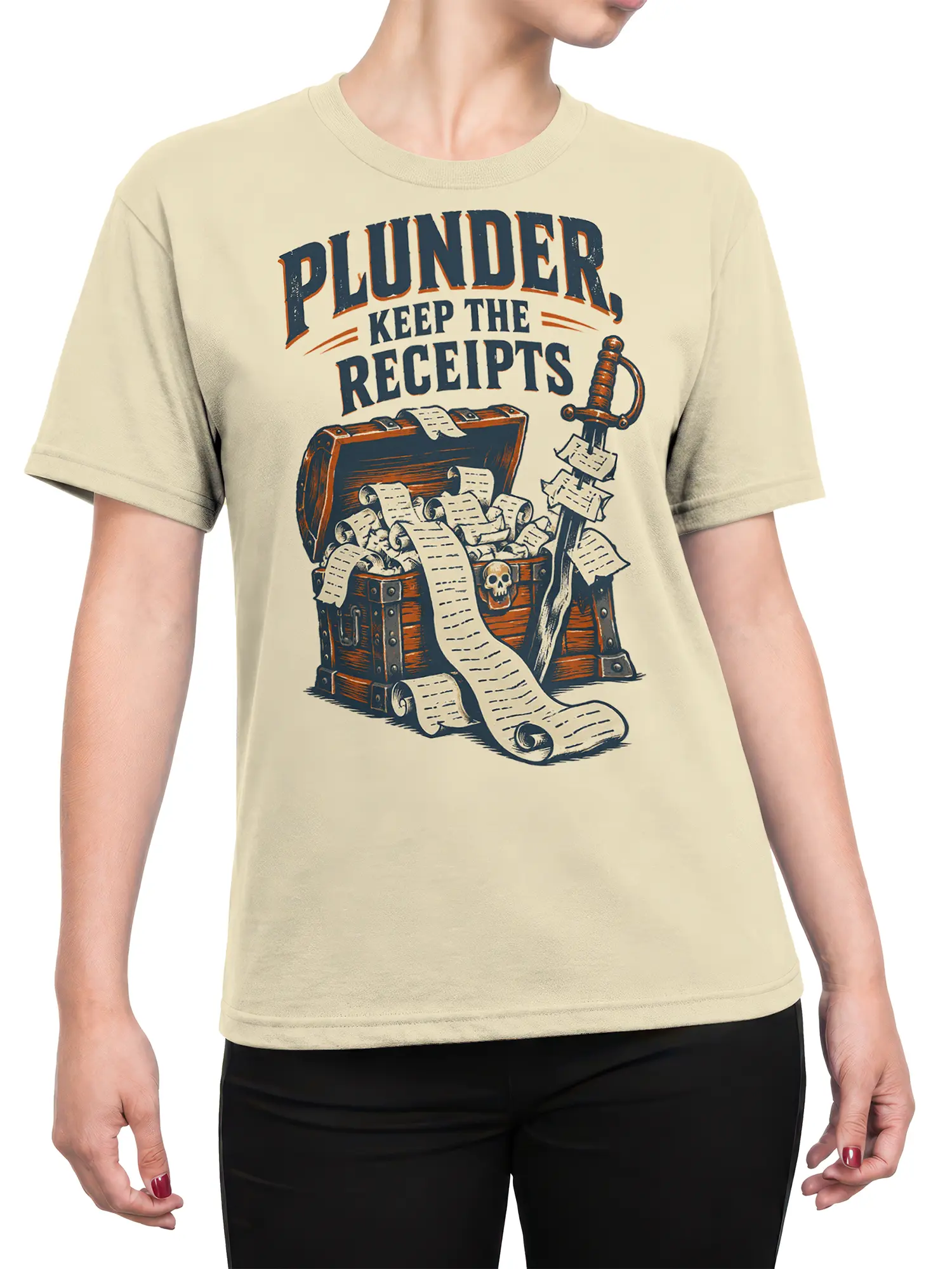 Female torso wearing a beige pirate t-shirt with treasure chest, scrolls, sword, and vintage “Plunder” graphic