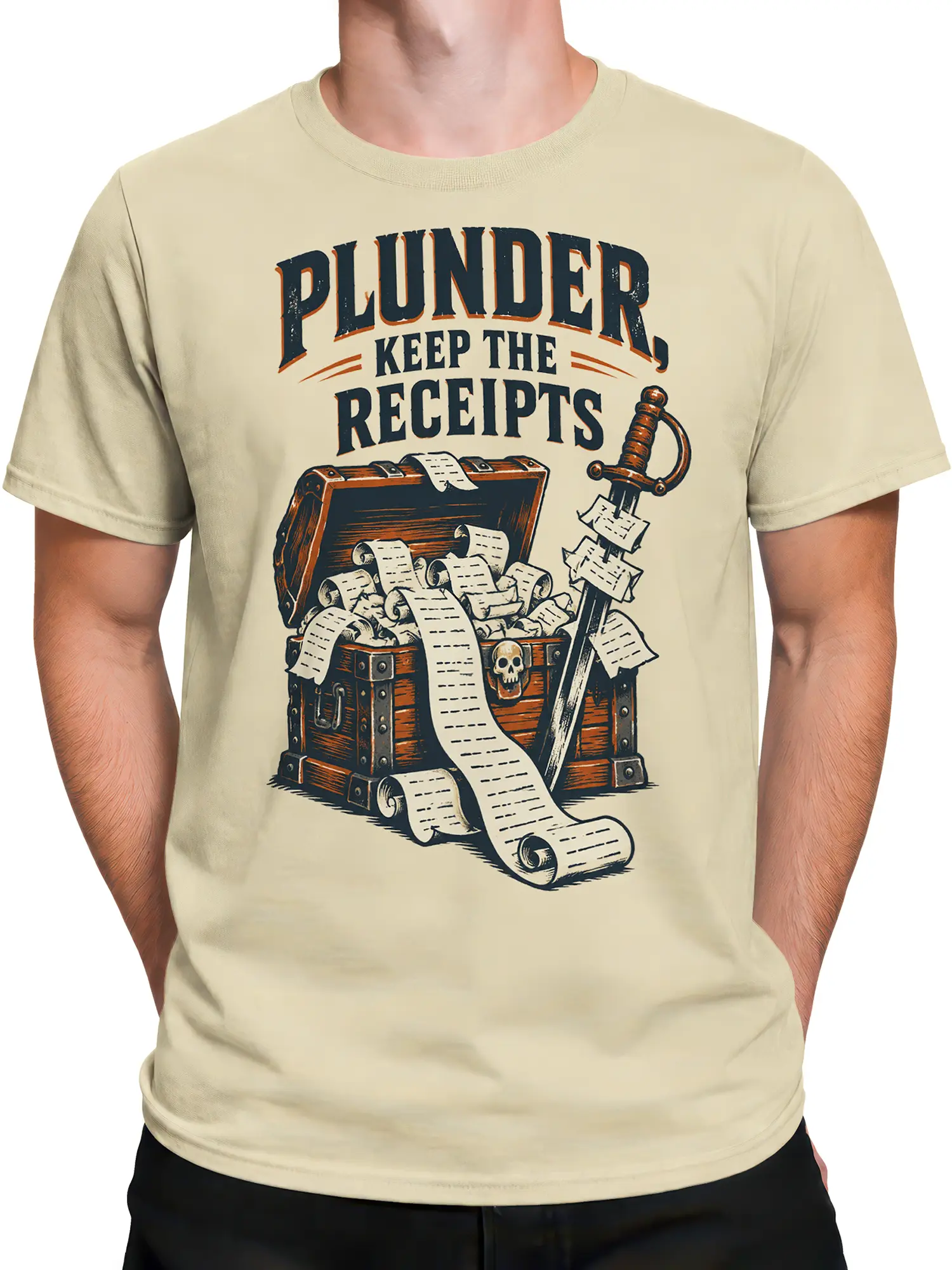 Male torso wearing a beige pirate t-shirt with wooden chest, sword, scrolls, skull, and receipt-themed artwork
