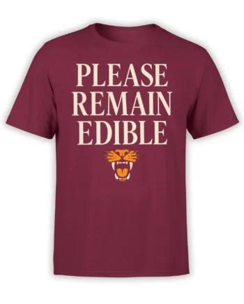 Burgundy T-shirt with bold cream “Please Remain Edible” text and an orange fanged mouth graphic