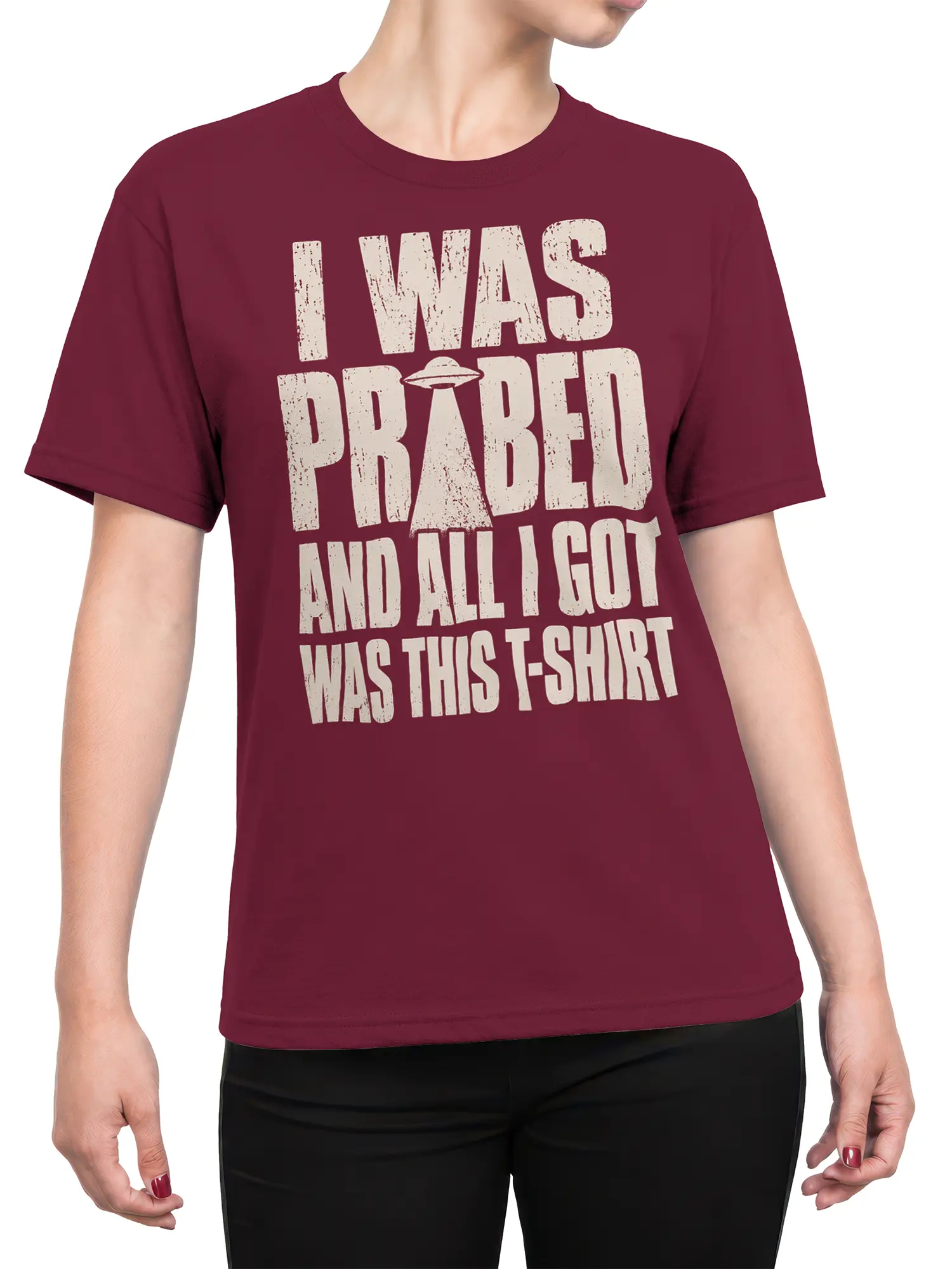 Female torso wearing burgundy alien T-shirt with distressed UFO slogan design
