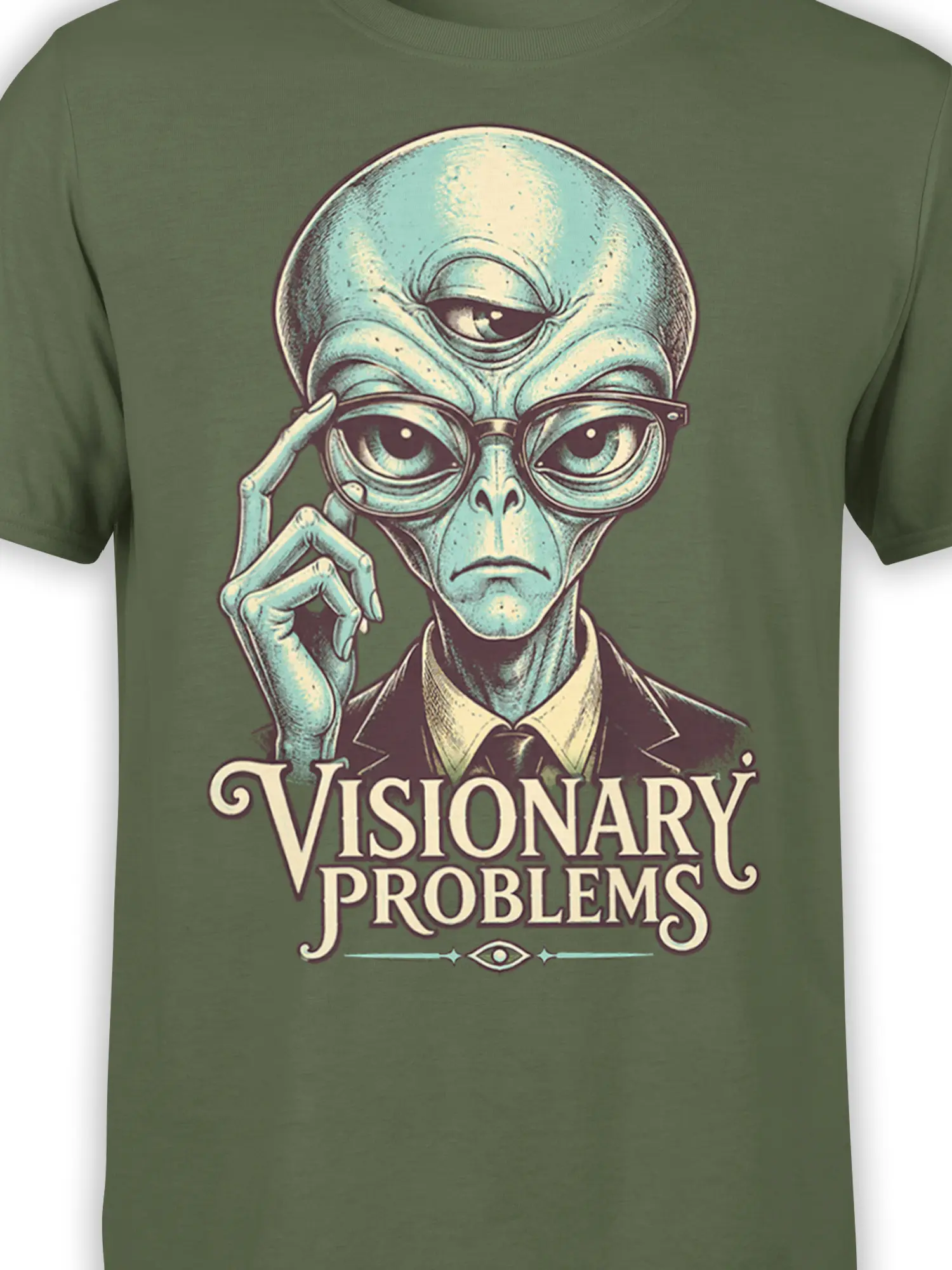 Close-up of the suited alien graphic, glasses, eye details, and “Visionary Problems” text on an olive shirt