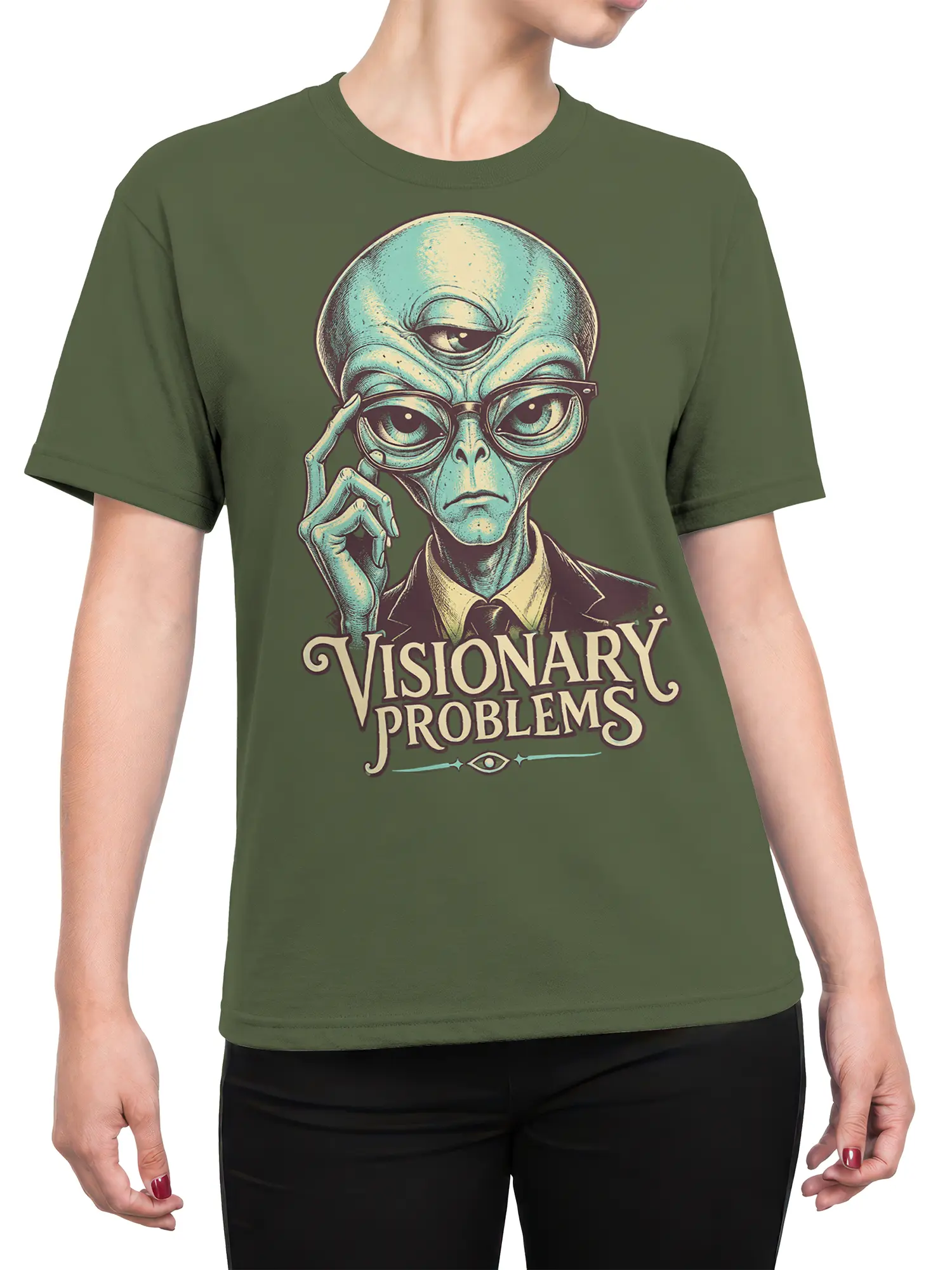 Female torso wearing an olive green alien T-shirt with glasses, suit artwork, and “Visionary Problems” text