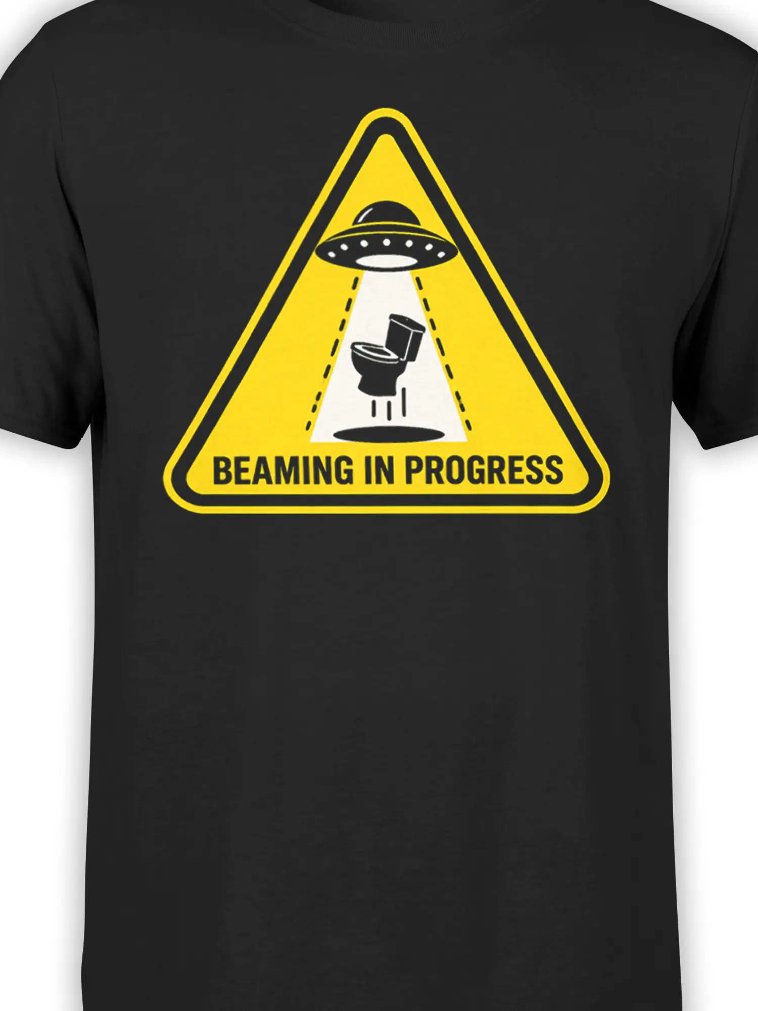 Close-up of black UFO graphic tee showing the yellow warning triangle and toilet beaming design