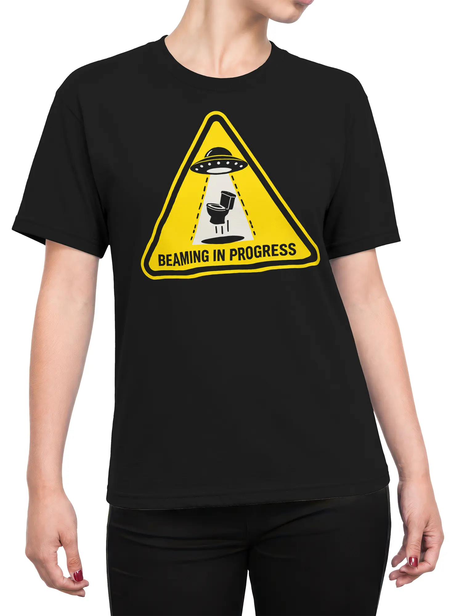 Female torso wearing a black UFO T-shirt with a yellow flying saucer and beamed-up toilet graphic