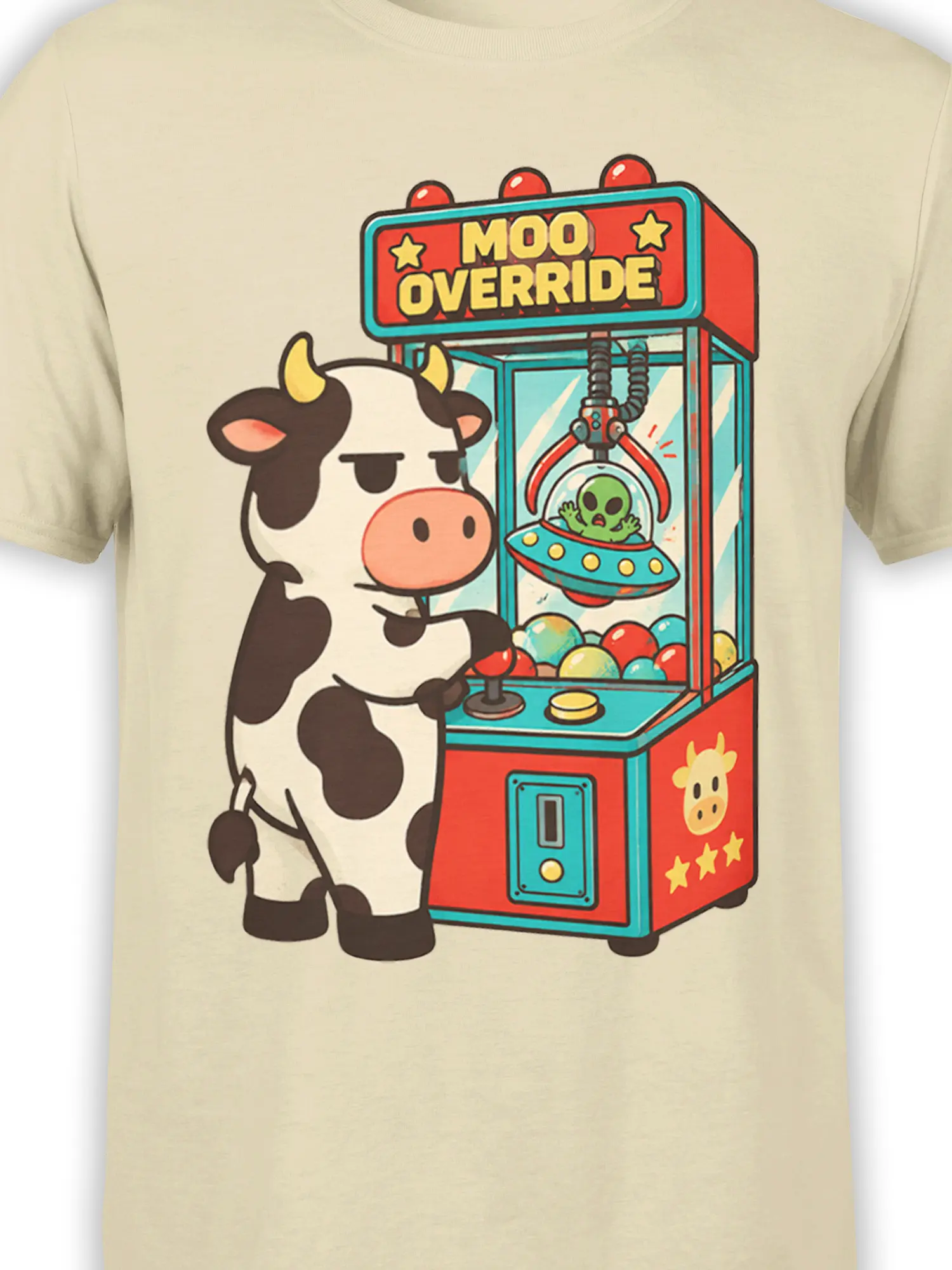 Close-up of cow, claw machine, alien prize, and Moo Override artwork on beige fabric